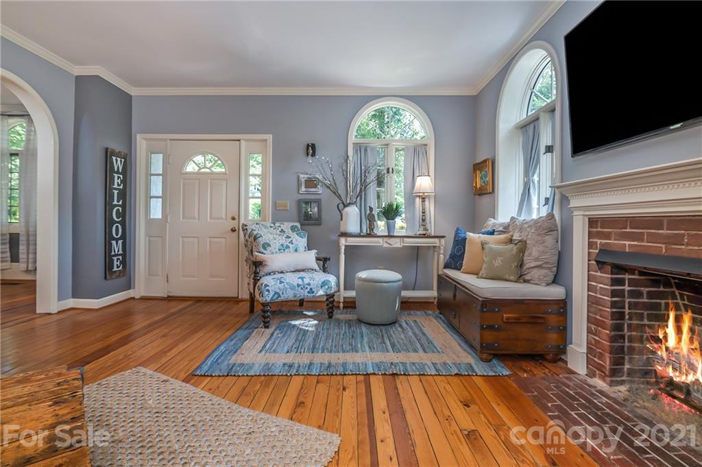 15 Doubleday Road Tryon, NC 28782 - Photo 7 of 46 a living room with furniture a fireplace and a flat screen tv