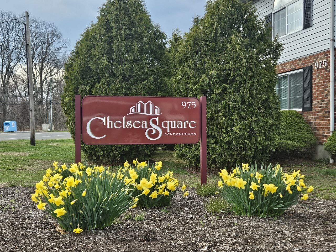 975 Meriden Road, Unit 11 Waterbury, CT 06705 - Photo 1 of 1 a sign on the side of the road