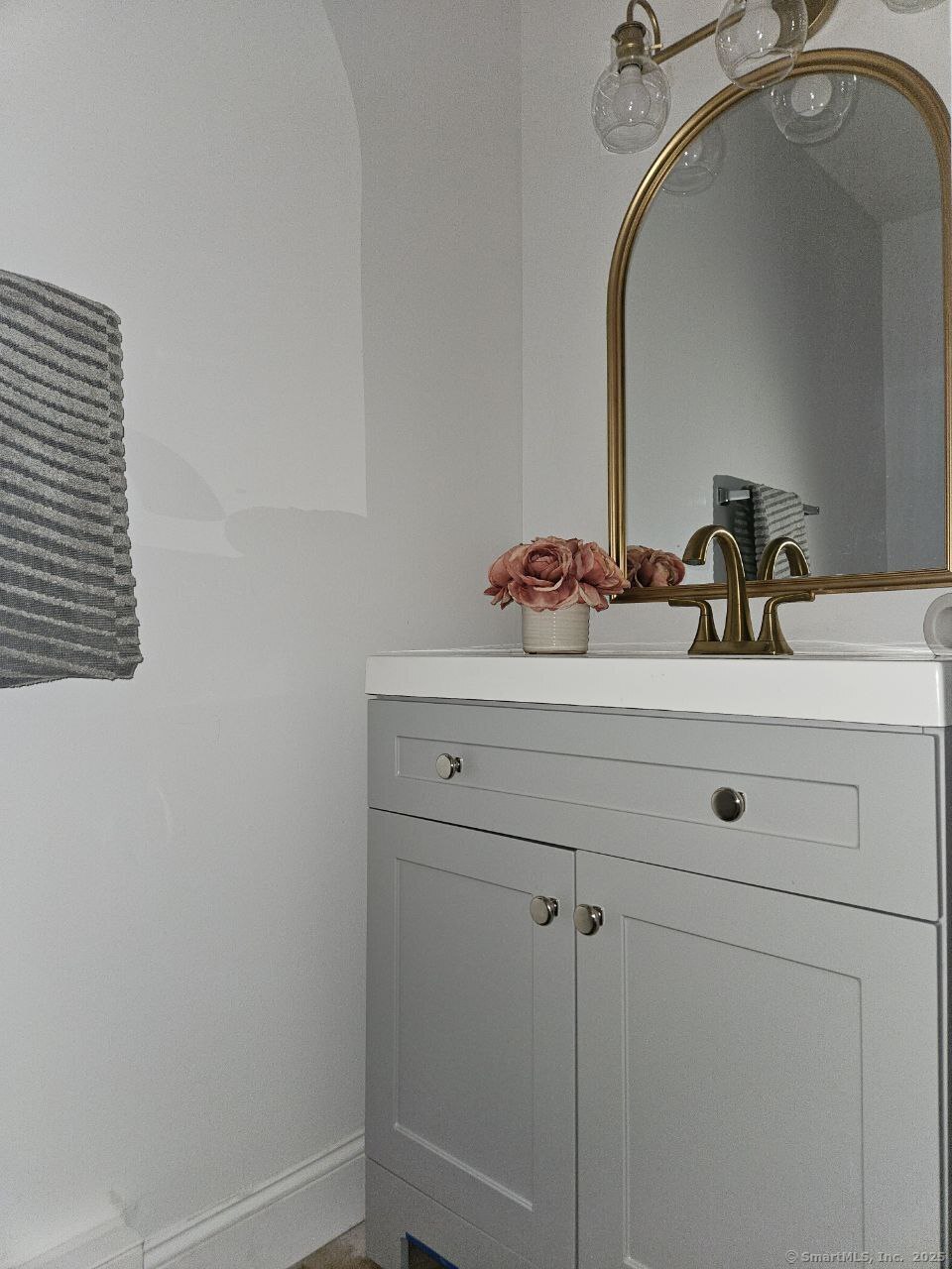 975 Meriden Road, Unit 11 Waterbury, CT 06705 - Photo 3 of 27 a bathroom with a sink and a mirror