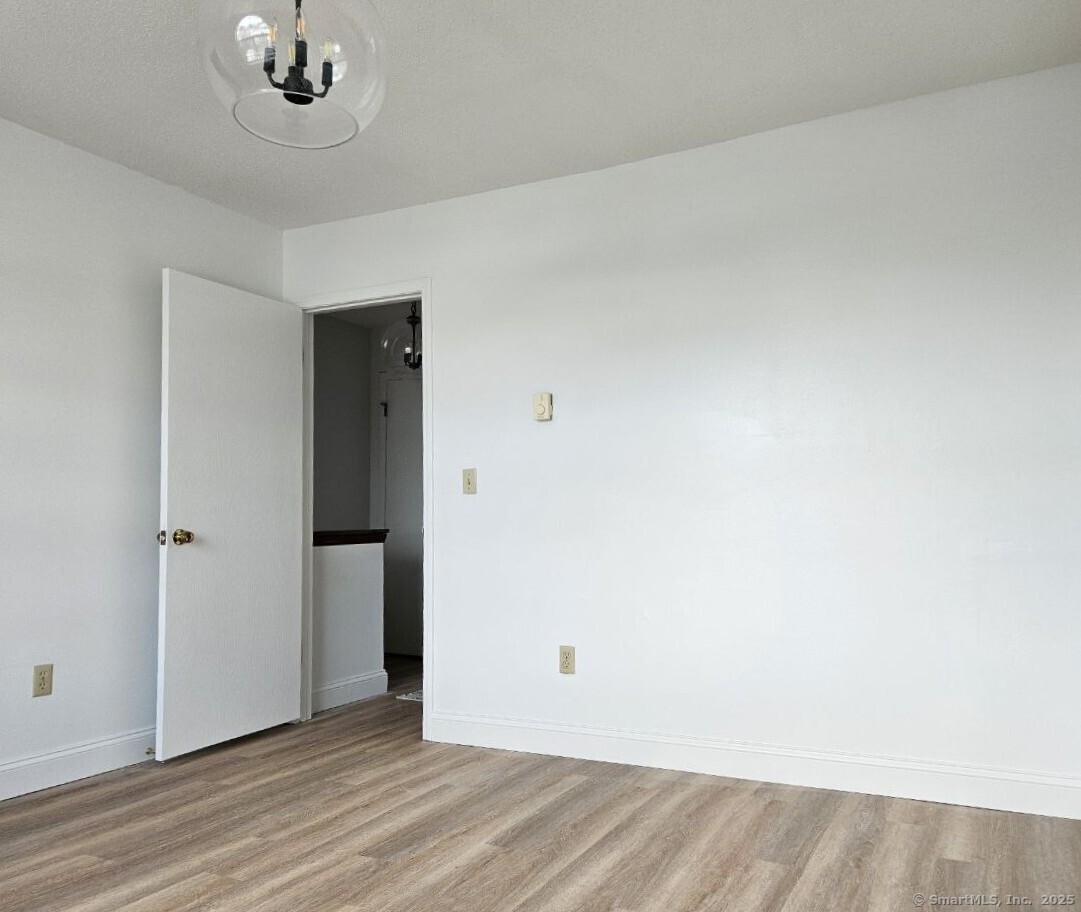 975 Meriden Road, Unit 11 Waterbury, CT 06705 - Photo 8 of 27 an empty room with a empty space