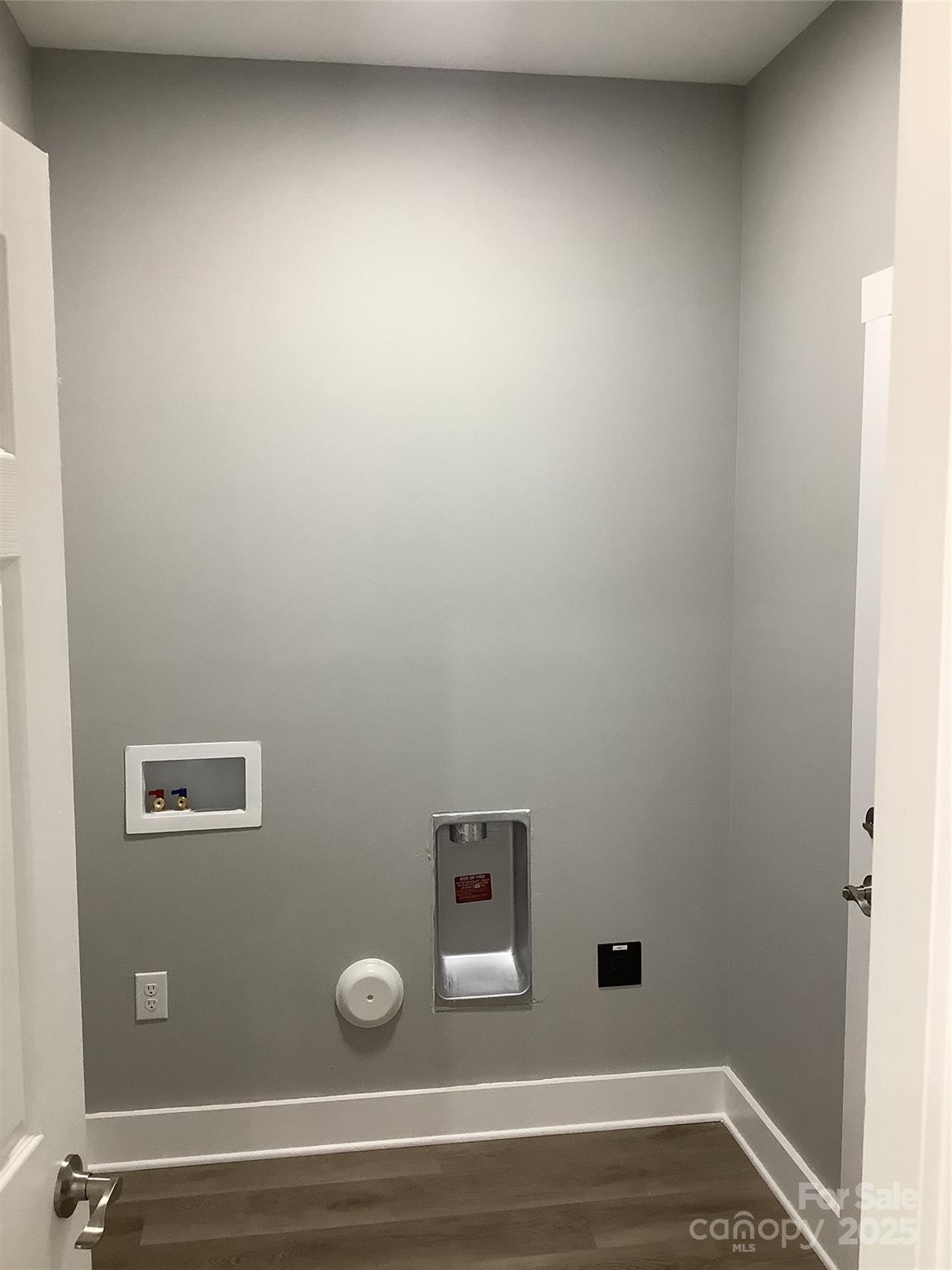 302 West 2nd Street Lowell, NC 28098 - Photo 11 of 17 a view of a livingroom with wooden floor
