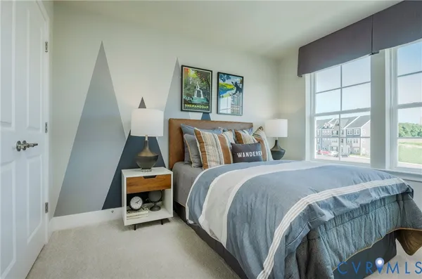 a bed room with a bed and a window