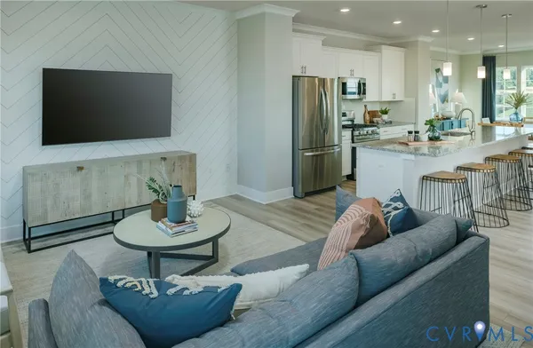 a living room with furniture and a flat screen tv