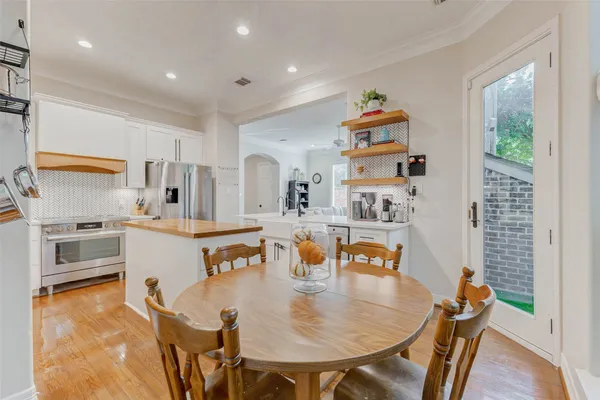 a kitchen with a sink appliances and a window