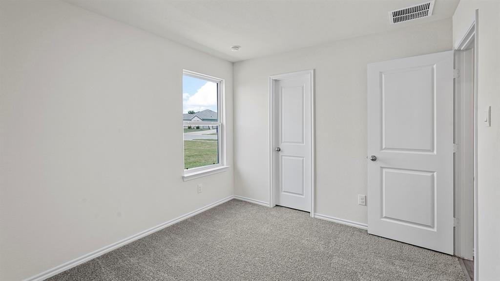 1675 Mantle Road Crandall, TX 75114 - Photo 25 of 27 Carpeted interior room with white walls
