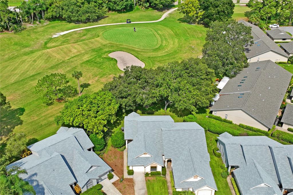 9108 Bassett Lane, Unit B New Port Richey, FL 34655 - Photo 53 of 66 an aerial view of a house with a yard and pool