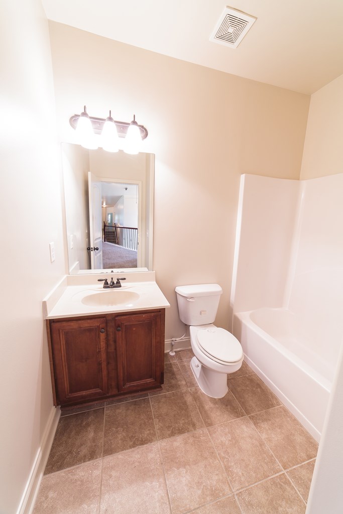 82 Riverside Landing Fort Mitchell, AL 36856 - Photo 35 of 47 a bathroom with a sink and a mirror