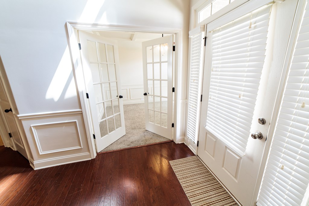 82 Riverside Landing Fort Mitchell, AL 36856 - Photo 5 of 47 a view of a hallway with wooden floor and stairs