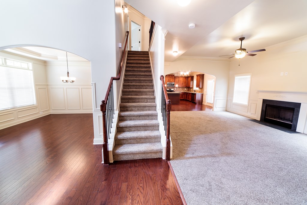 82 Riverside Landing Fort Mitchell, AL 36856 - Photo 8 of 47 a view of a livingroom with wooden floor and stairs