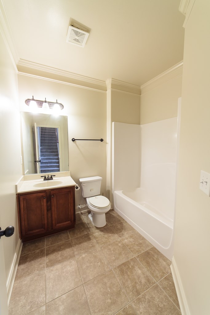 82 Riverside Landing Fort Mitchell, AL 36856 - Photo 9 of 47 a bathroom with a sink a toilet and shower
