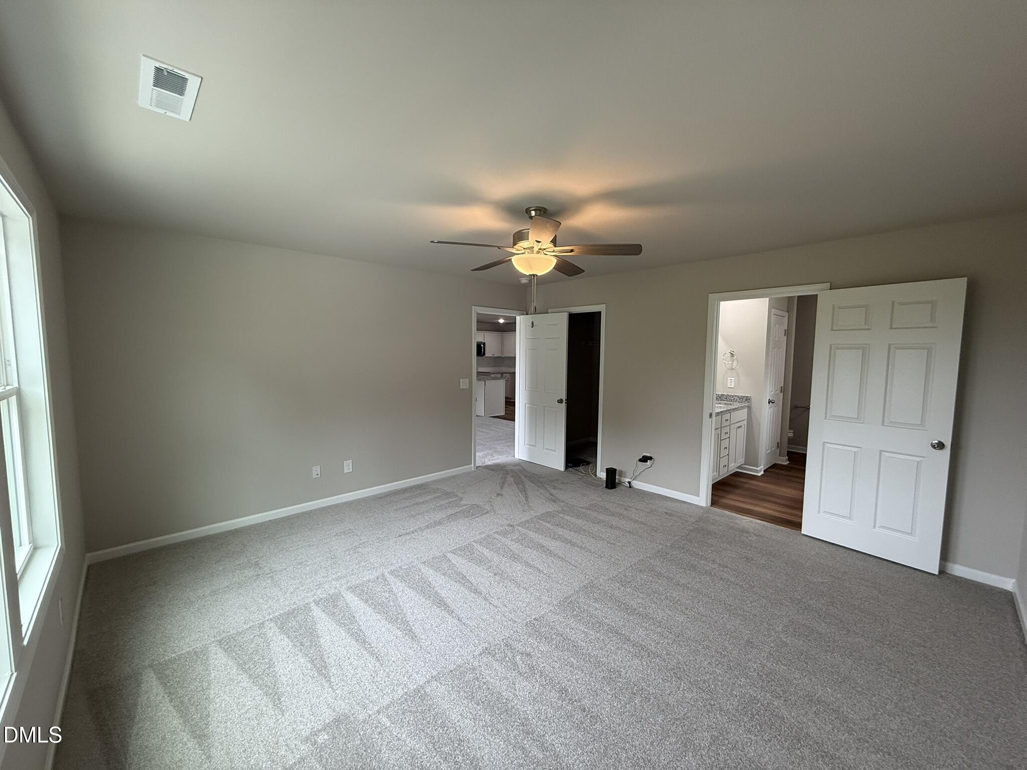 1853 Old Kenly Road Kenly, NC 27542 - Photo 13 of 22 wooden floor in an empty room with a window