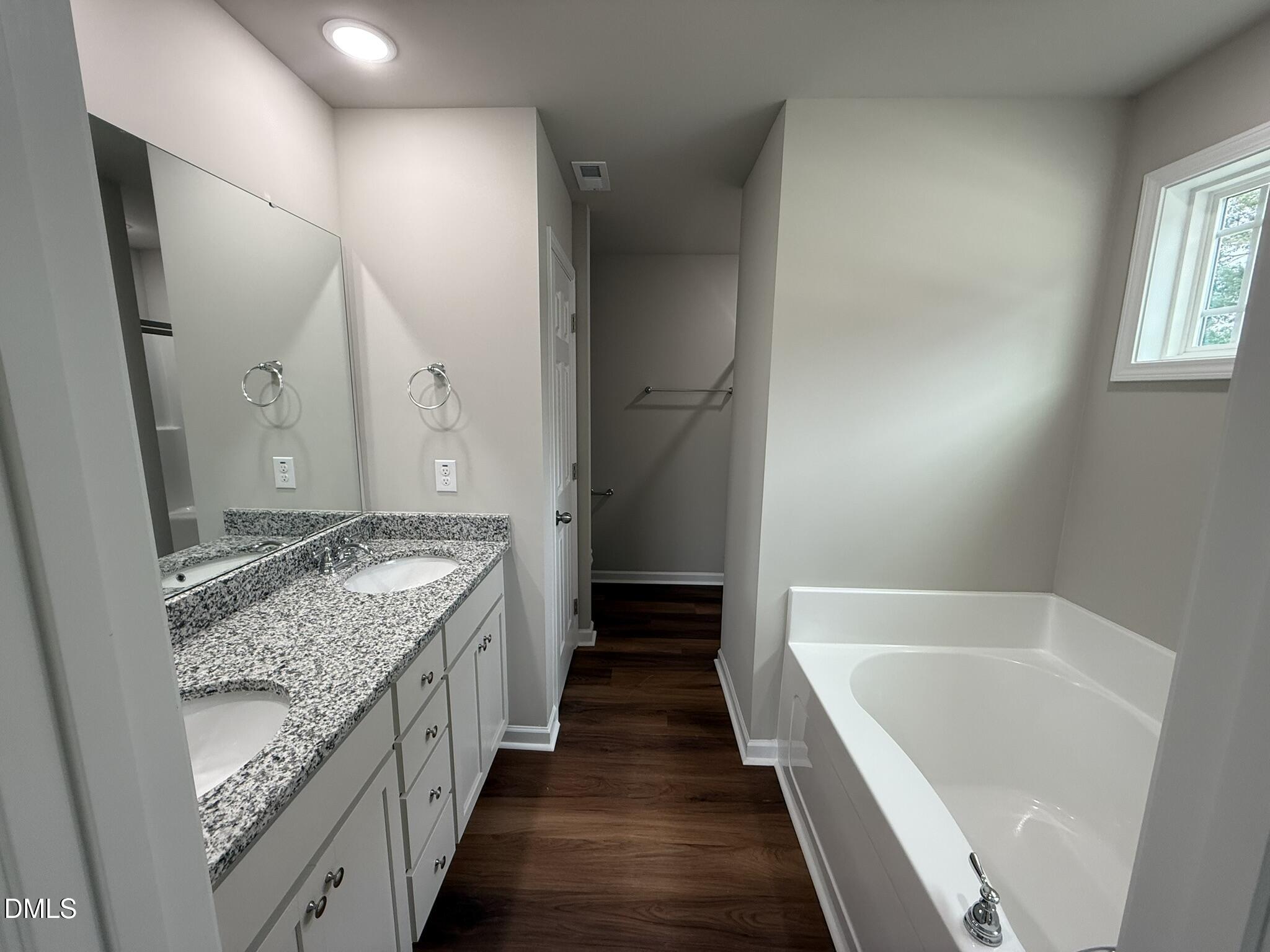 1853 Old Kenly Road Kenly, NC 27542 - Photo 14 of 22 a bathroom with a granite countertop tub sink and mirror