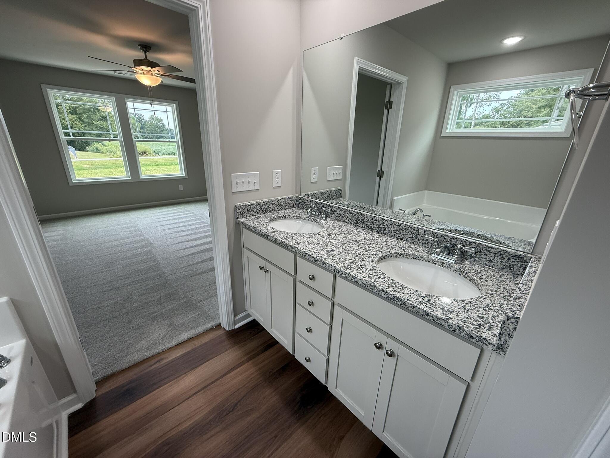 1853 Old Kenly Road Kenly, NC 27542 - Photo 15 of 22 a bathroom with a granite countertop sink and a mirror