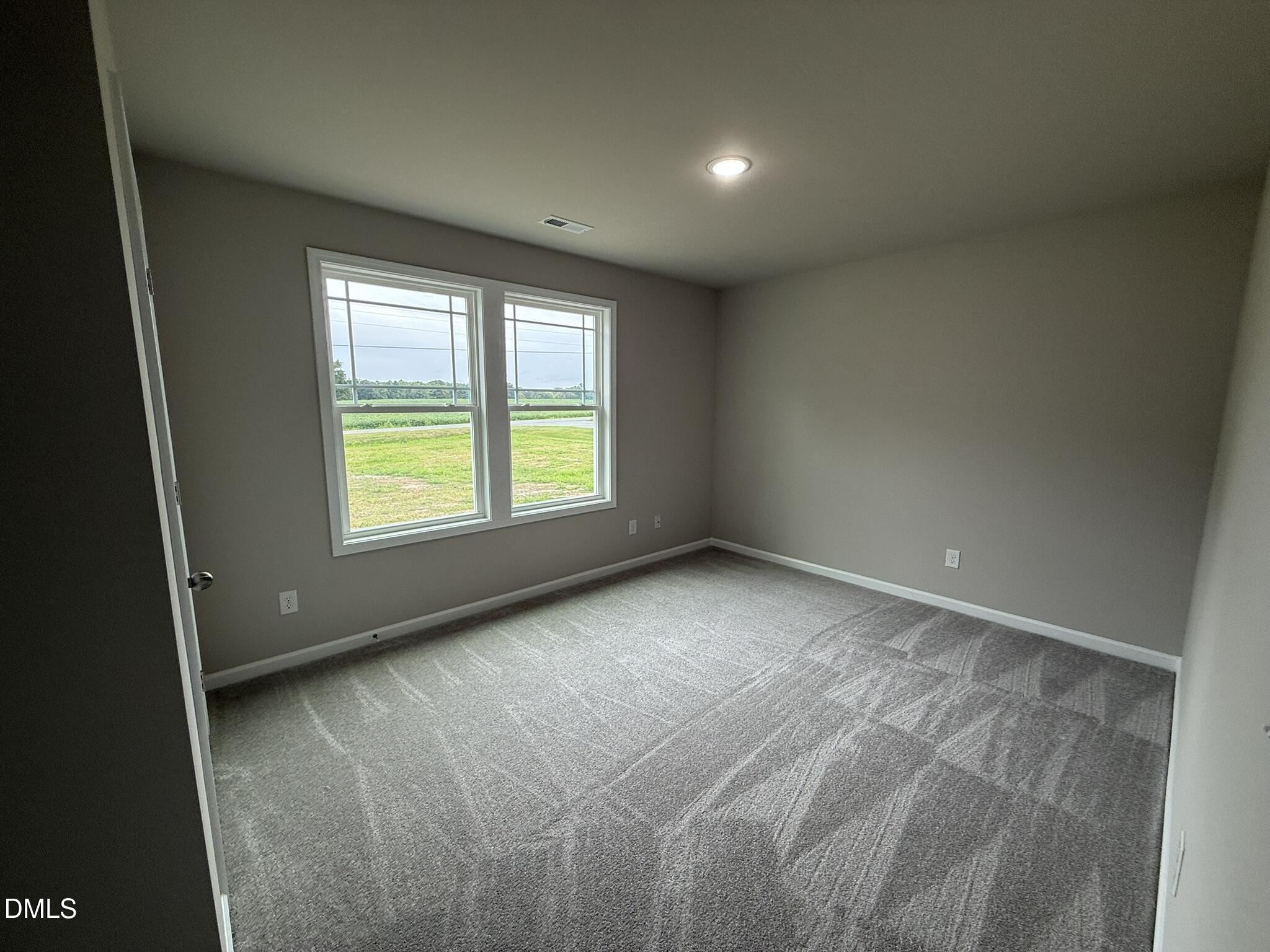 1853 Old Kenly Road Kenly, NC 27542 - Photo 18 of 22 an empty room with windows