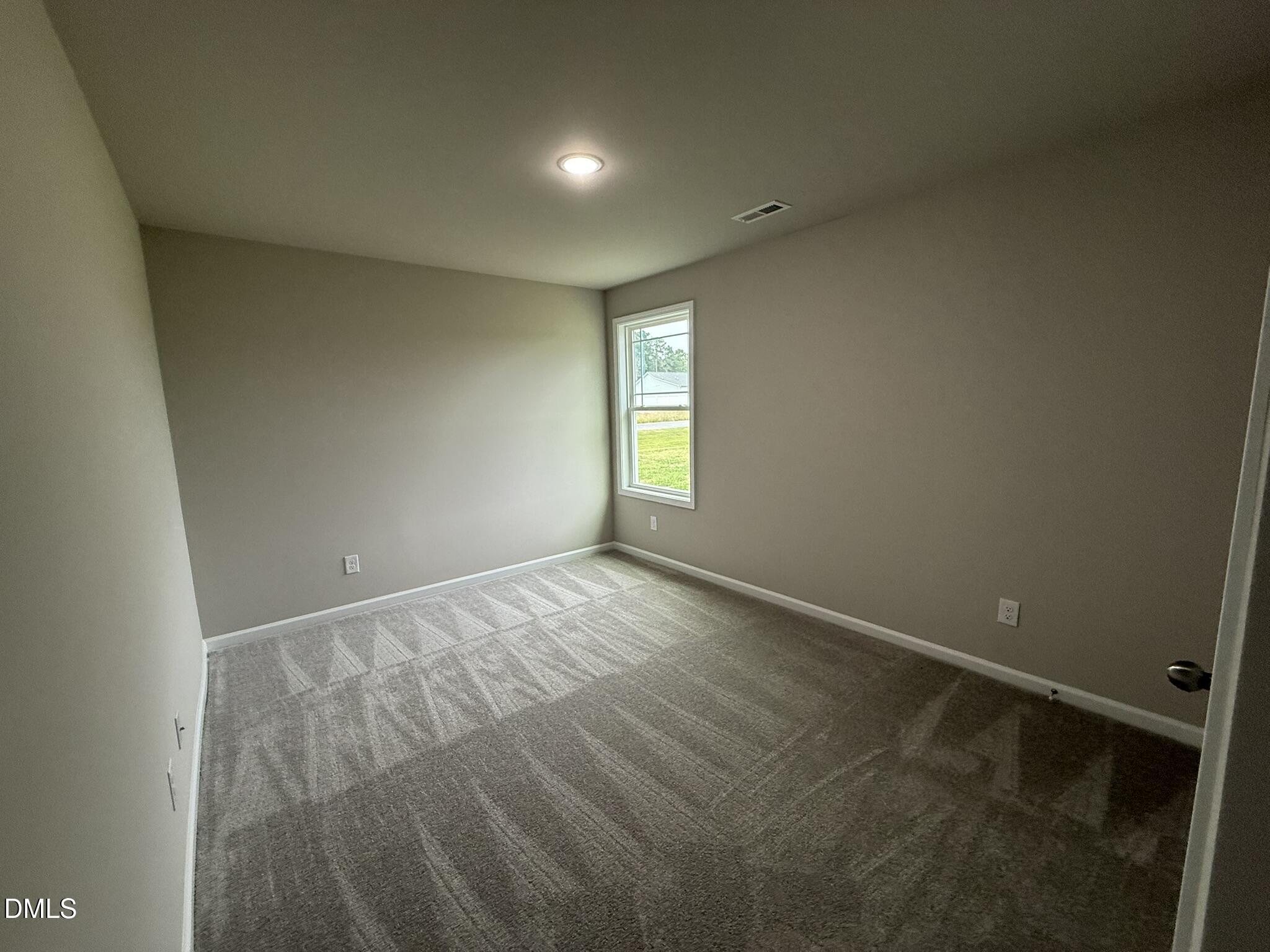 1853 Old Kenly Road Kenly, NC 27542 - Photo 19 of 22 an empty room with windows