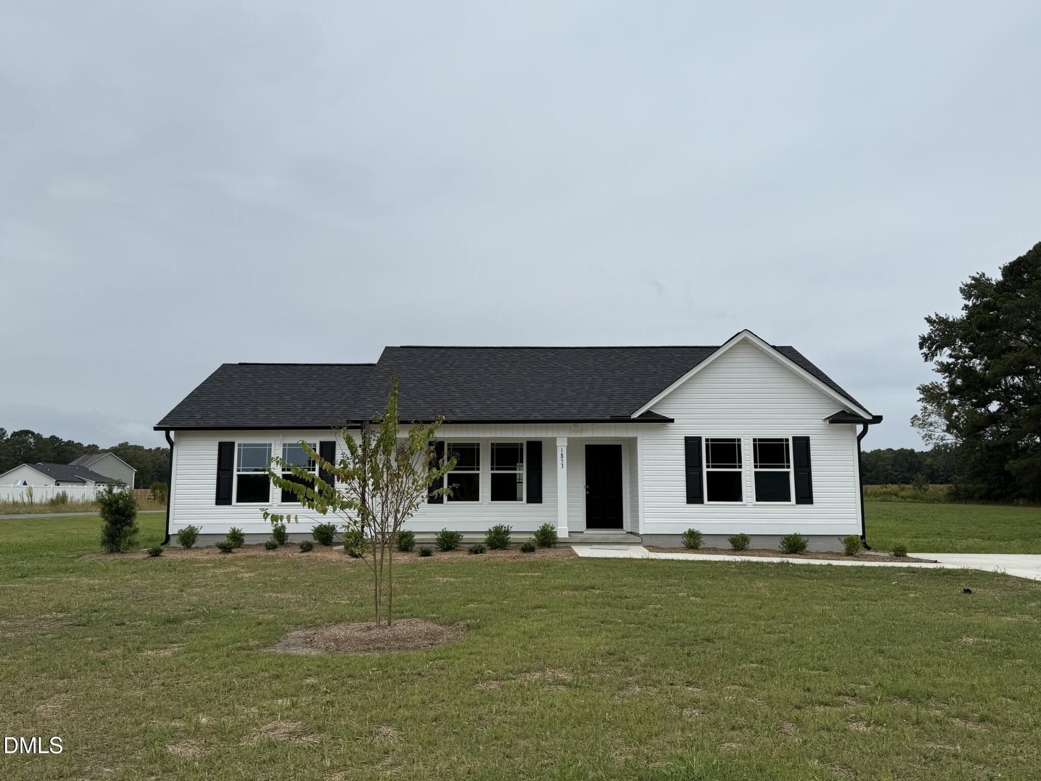1853 Old Kenly Road Kenly, NC 27542 - Photo 2 of 22 a front view of a house with a garden