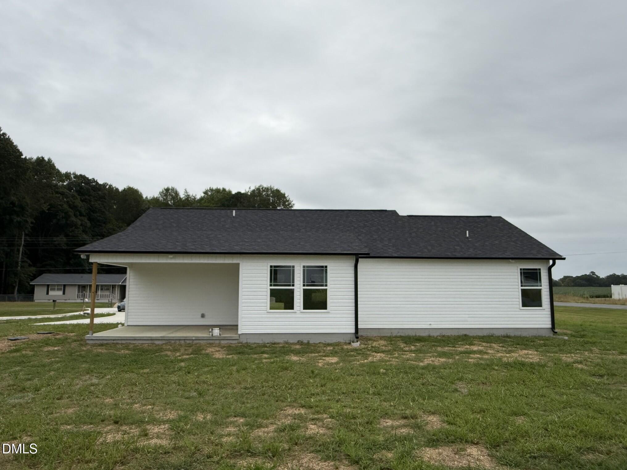 1853 Old Kenly Road Kenly, NC 27542 - Photo 21 of 22 a front view of a house with a garden