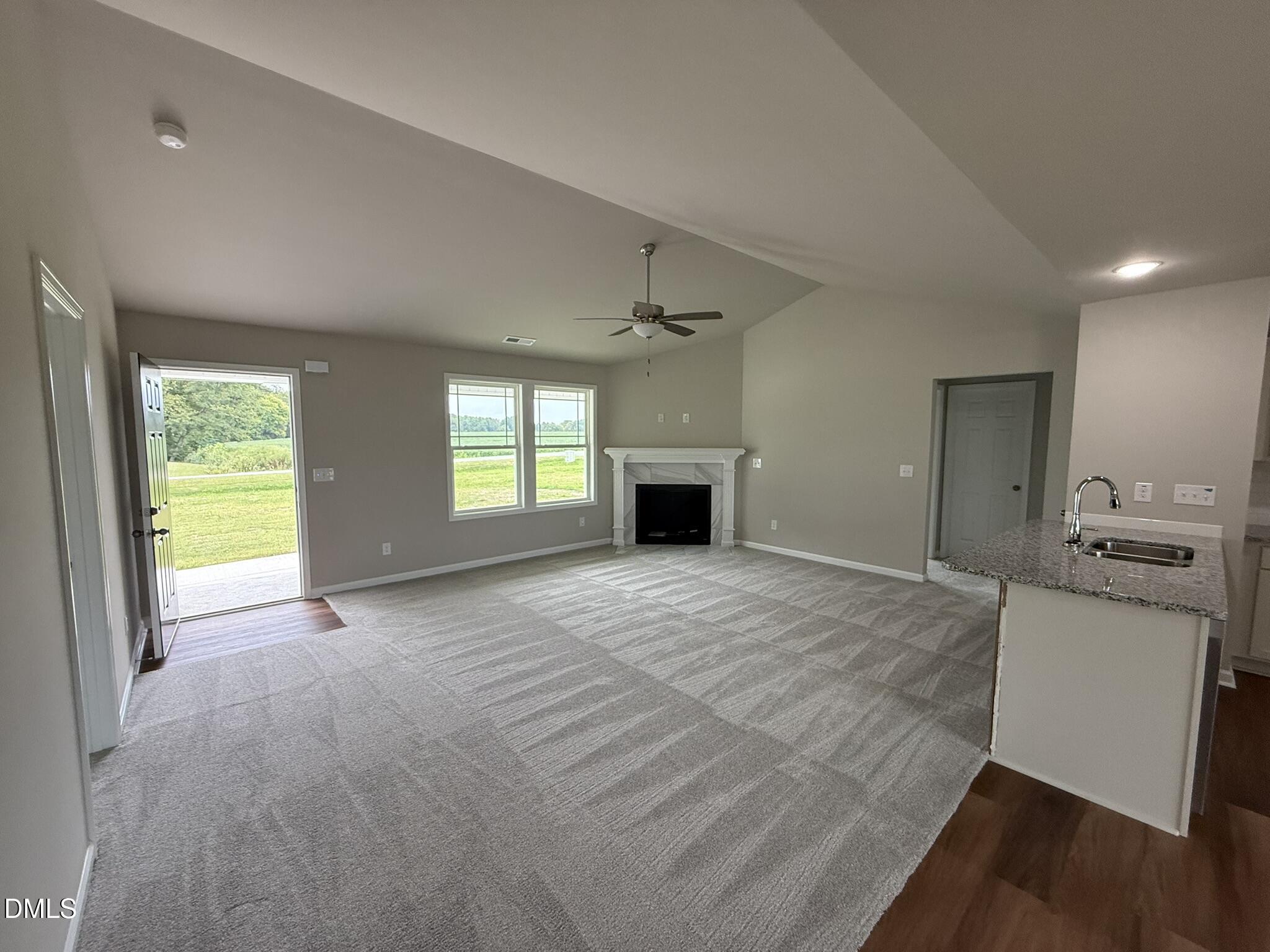 1853 Old Kenly Road Kenly, NC 27542 - Photo 4 of 22 a view of a kitchen with a sink and a stove top oven