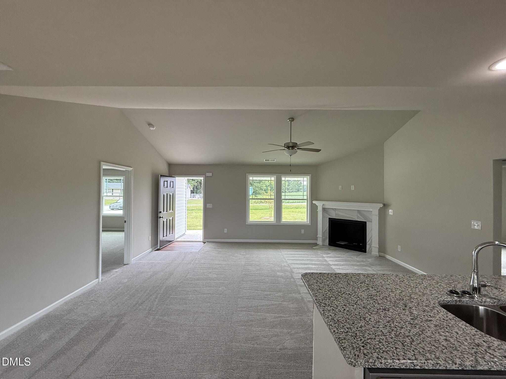 1853 Old Kenly Road Kenly, NC 27542 - Photo 6 of 22 a view of an empty room with window and fire place