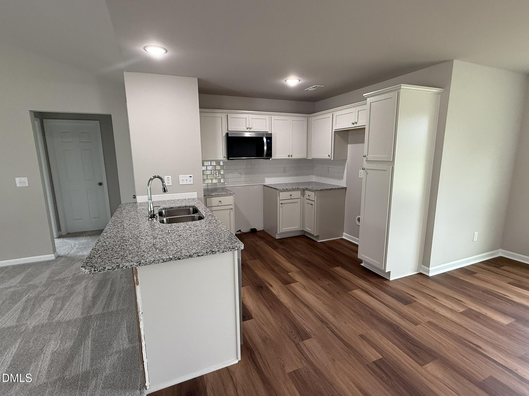 1853 Old Kenly Road Kenly, NC 27542 - Photo 9 of 22 a kitchen with a sink and refrigerator