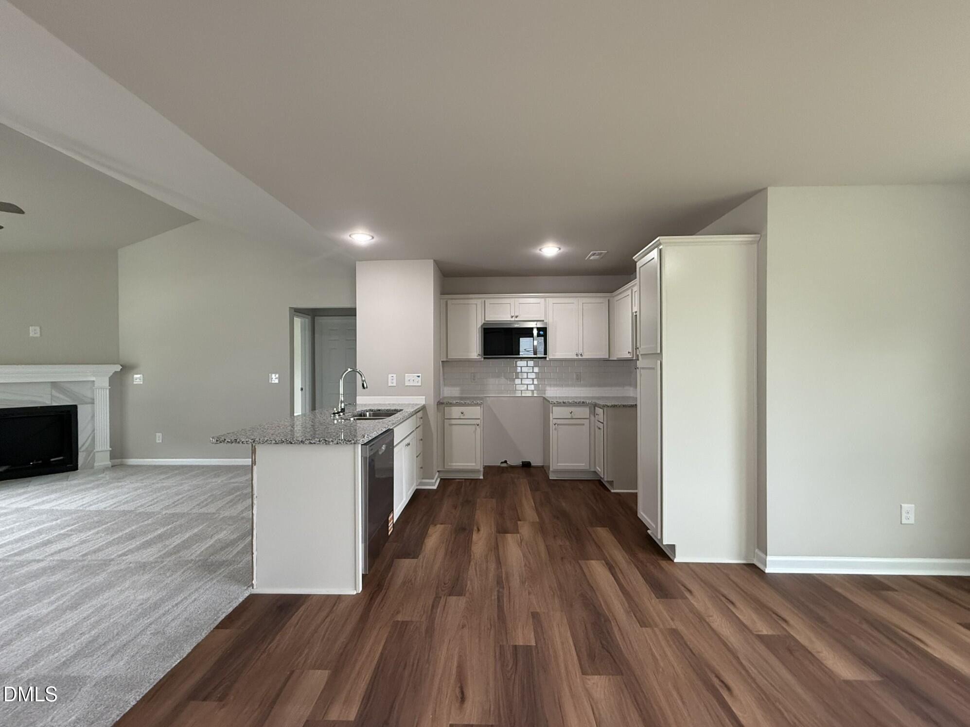 1853 Old Kenly Road Kenly, NC 27542 - Photo 10 of 22 a kitchen with stainless steel appliances a refrigerator sink and cabinets