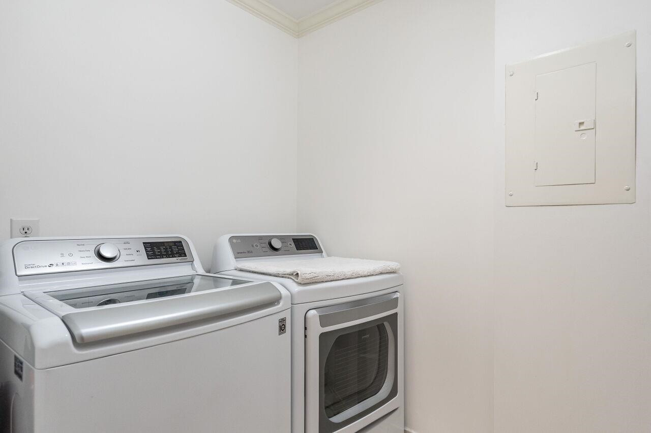 1802 Saluda Court Raleigh, NC 27608 - Photo 21 of 22 Laundry Room with cabinets and tile floor. Laundry Room