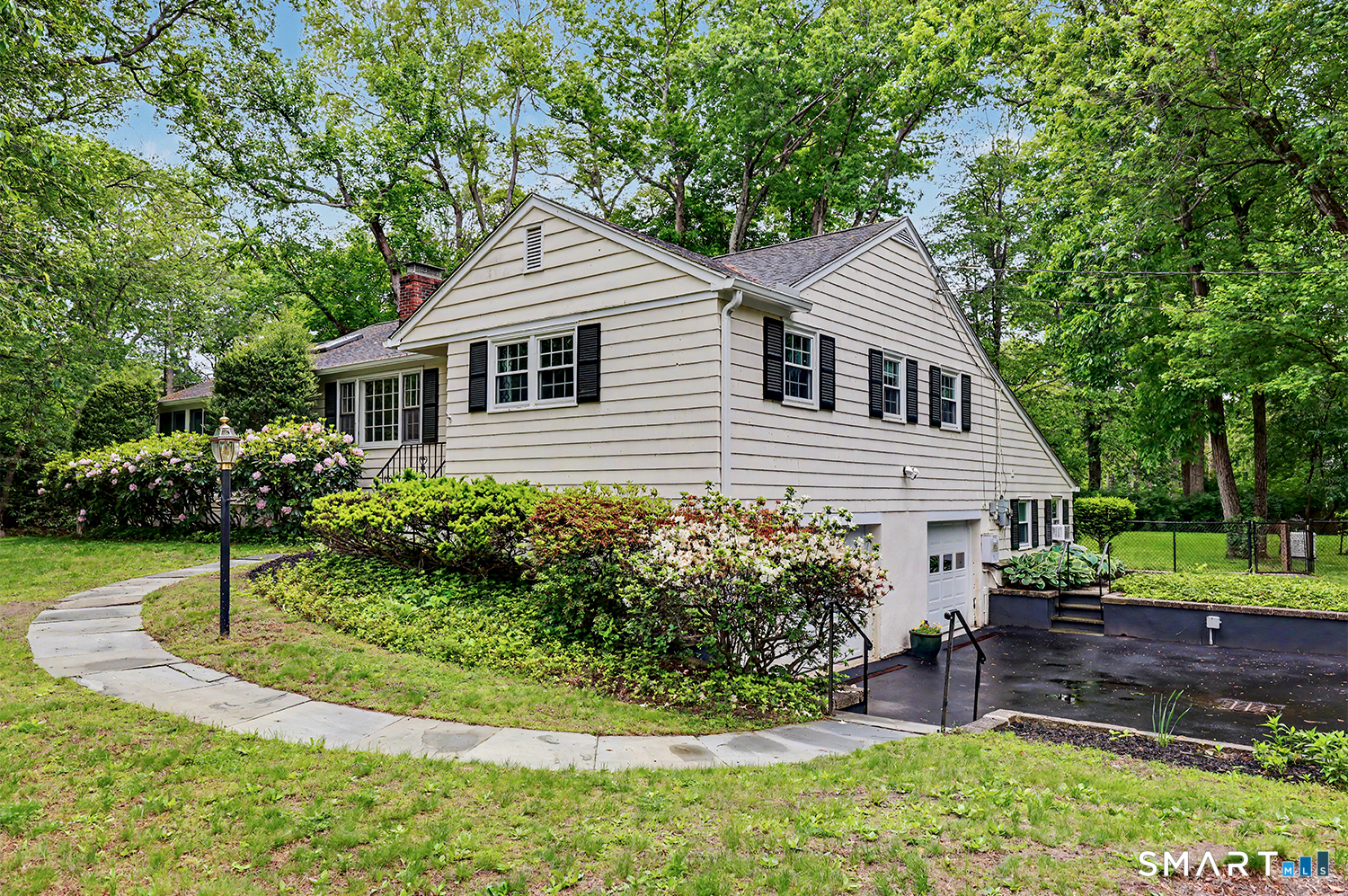 19 Geneva Road Norwalk, CT 06850 - Photo 2 of 33 a front view of a house with a yard