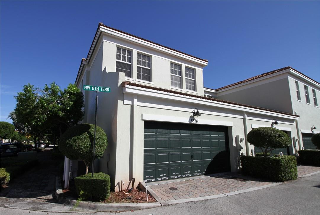 8316 Northwest 8th Terrace Boca Raton, FL 33487 - Photo 1 of 34 a front view of a house with a garage