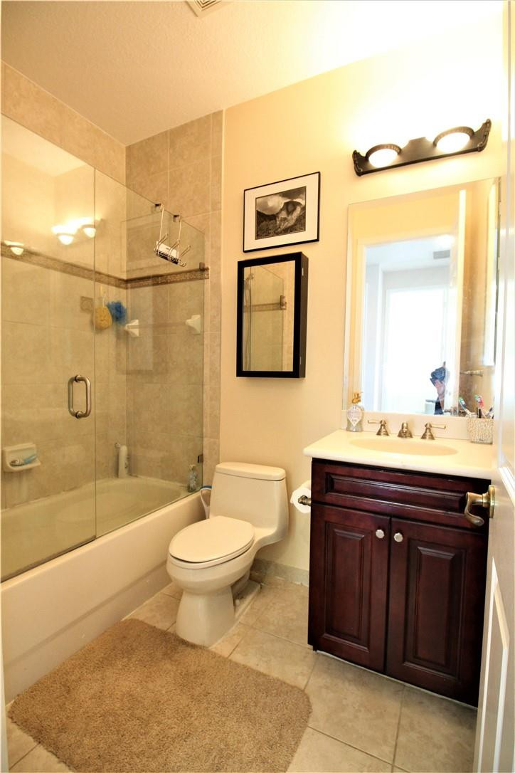 8316 Northwest 8th Terrace Boca Raton, FL 33487 - Photo 15 of 34 a bathroom with a sink and a mirror
