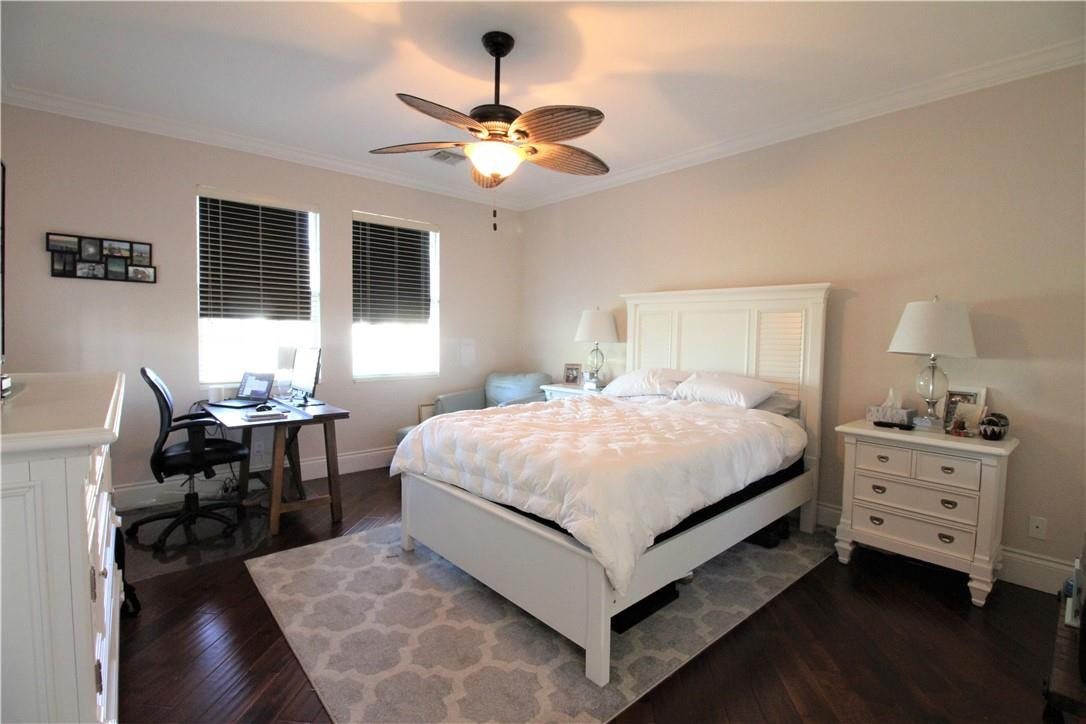8316 Northwest 8th Terrace Boca Raton, FL 33487 - Photo 18 of 34 a bedroom with a bed and a chandelier