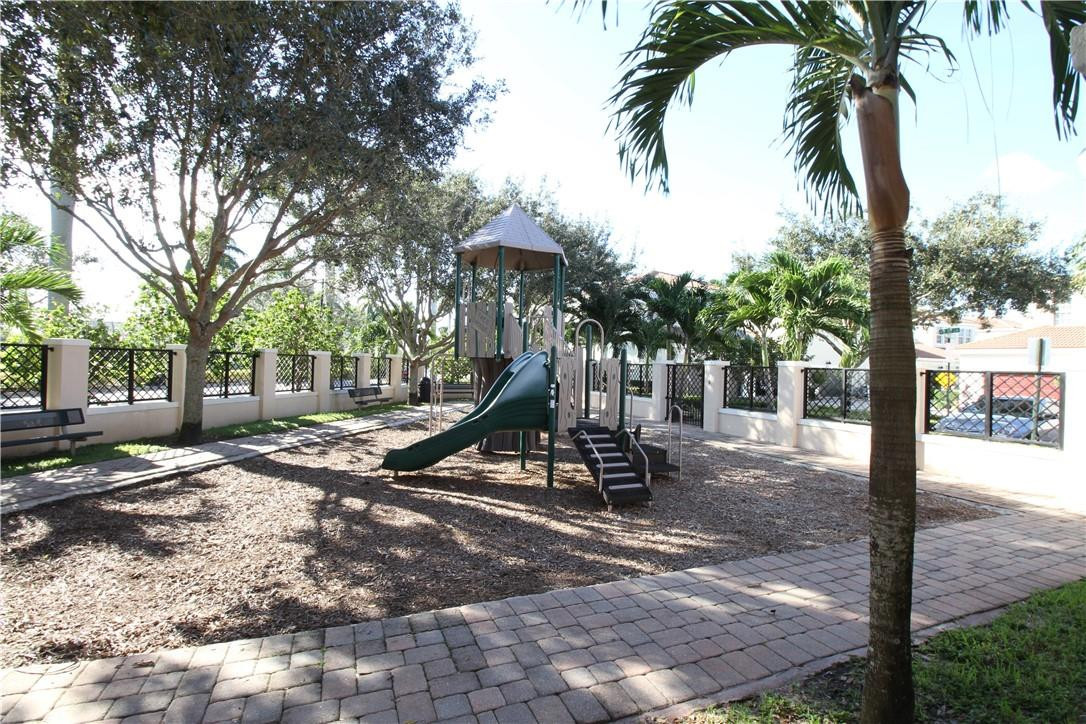 8316 Northwest 8th Terrace Boca Raton, FL 33487 - Photo 33 of 34 a view of a park with swings and slides