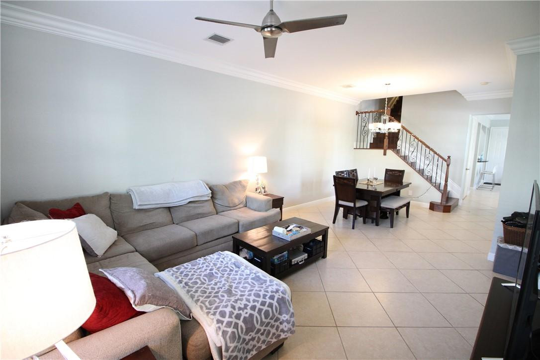 8316 Northwest 8th Terrace Boca Raton, FL 33487 - Photo 6 of 34 a living room with furniture and wooden floor