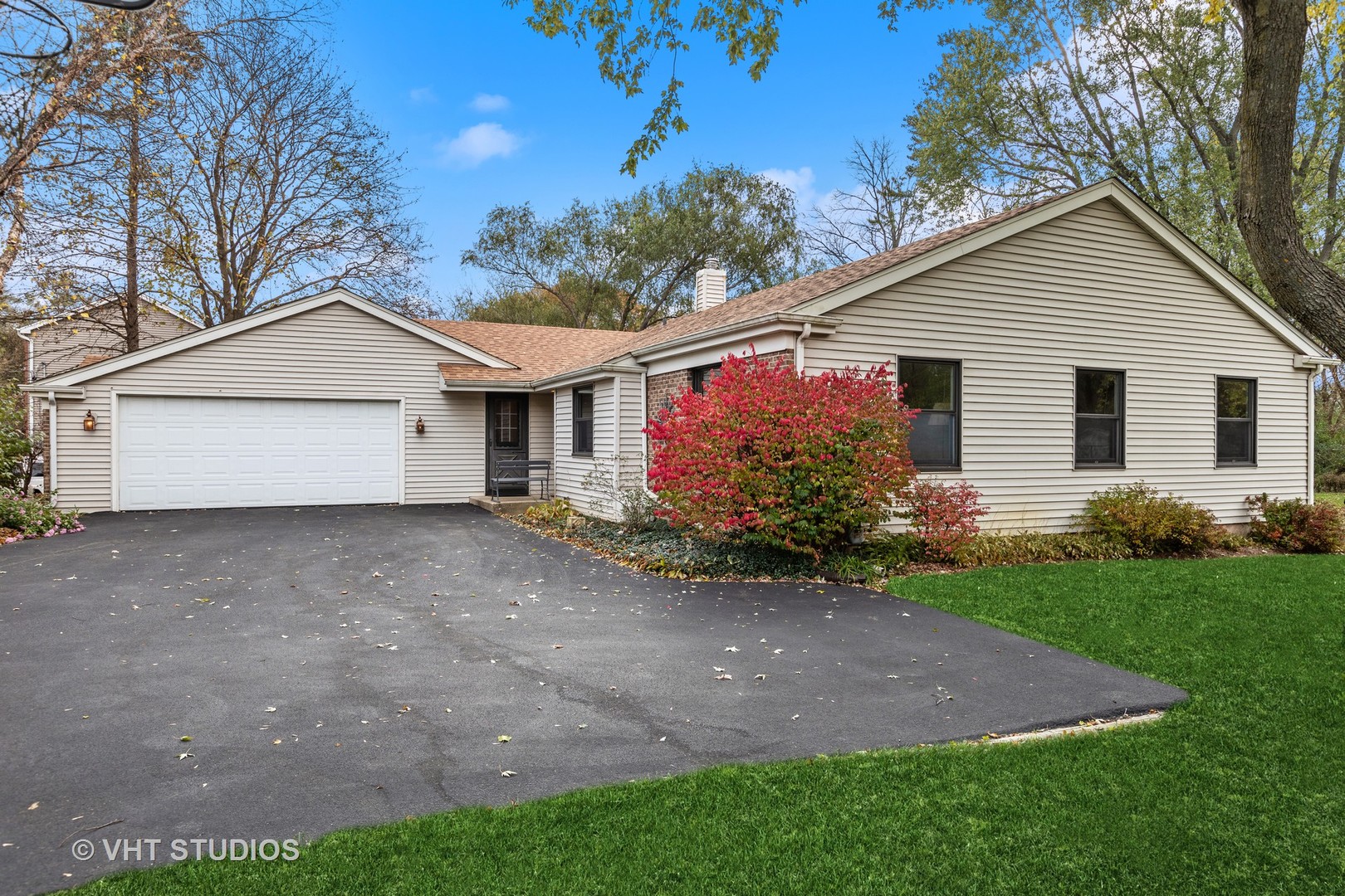 301 Oak Crest Road Cary, IL 60013 - Photo 3 of 27 a view of a house with a yard and a garden