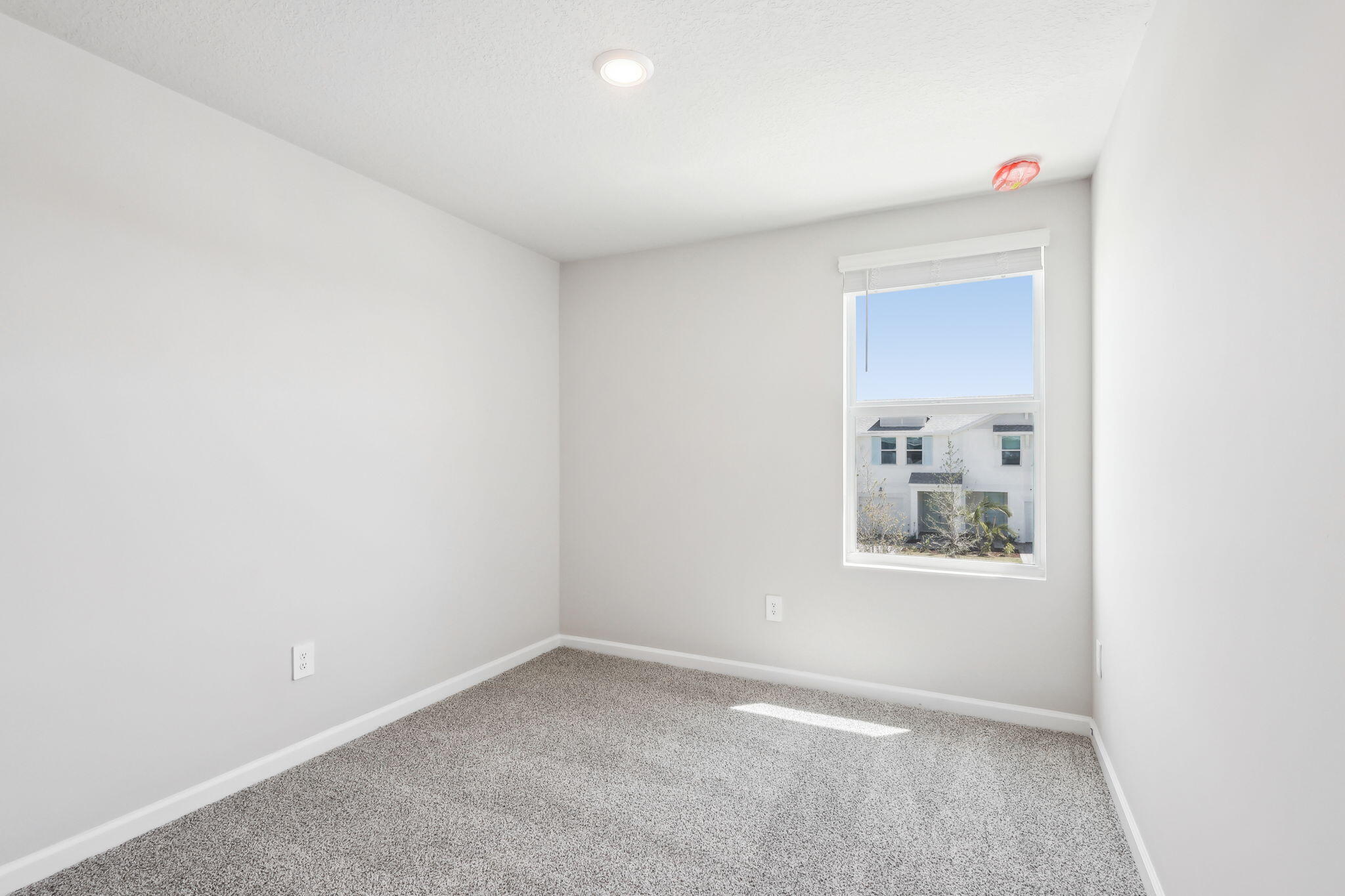 478 Salisbury Circle Fort Pierce, FL 34982 - Photo 19 of 35 a view of a small space with wooden floor and a window