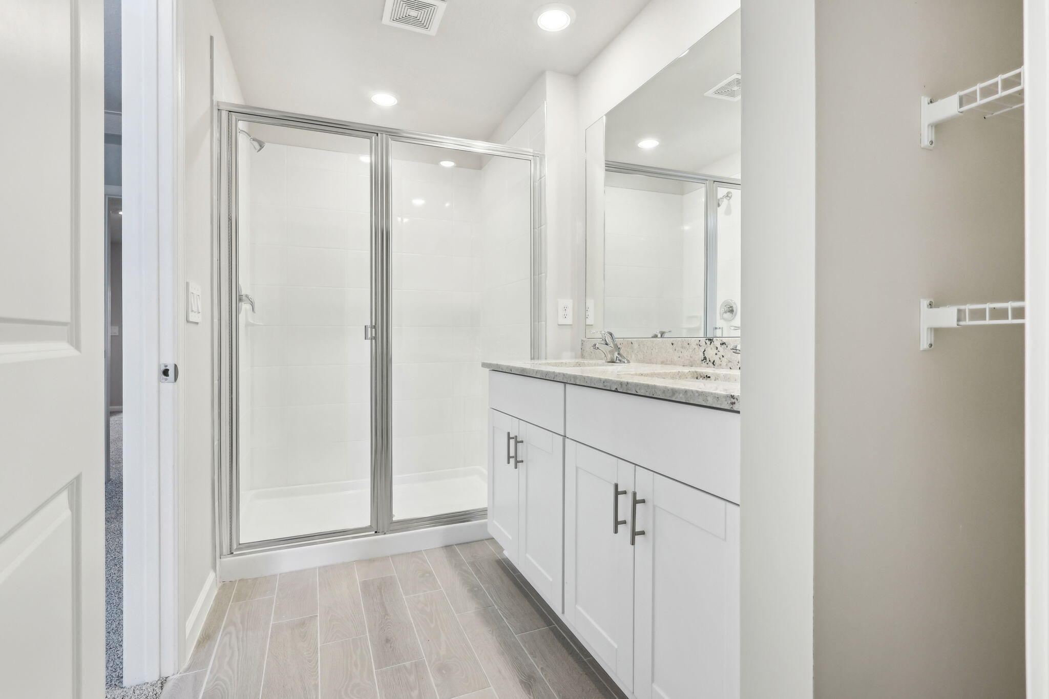 478 Salisbury Circle Fort Pierce, FL 34982 - Photo 30 of 35 a bathroom with a double vanity sink mirror and shower