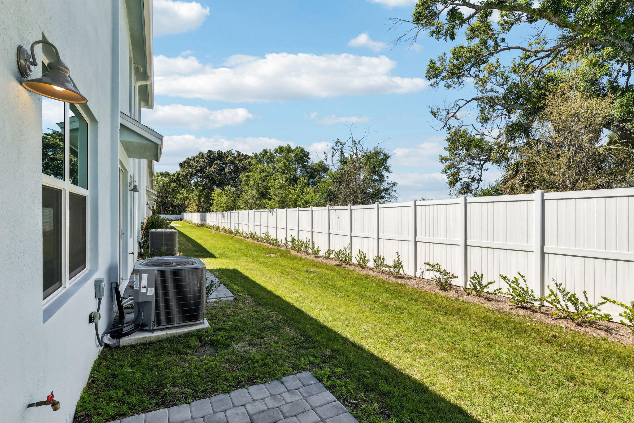 478 Salisbury Circle Fort Pierce, FL 34982 - Photo 32 of 35 a view of yard with swimming pool and trees in the background