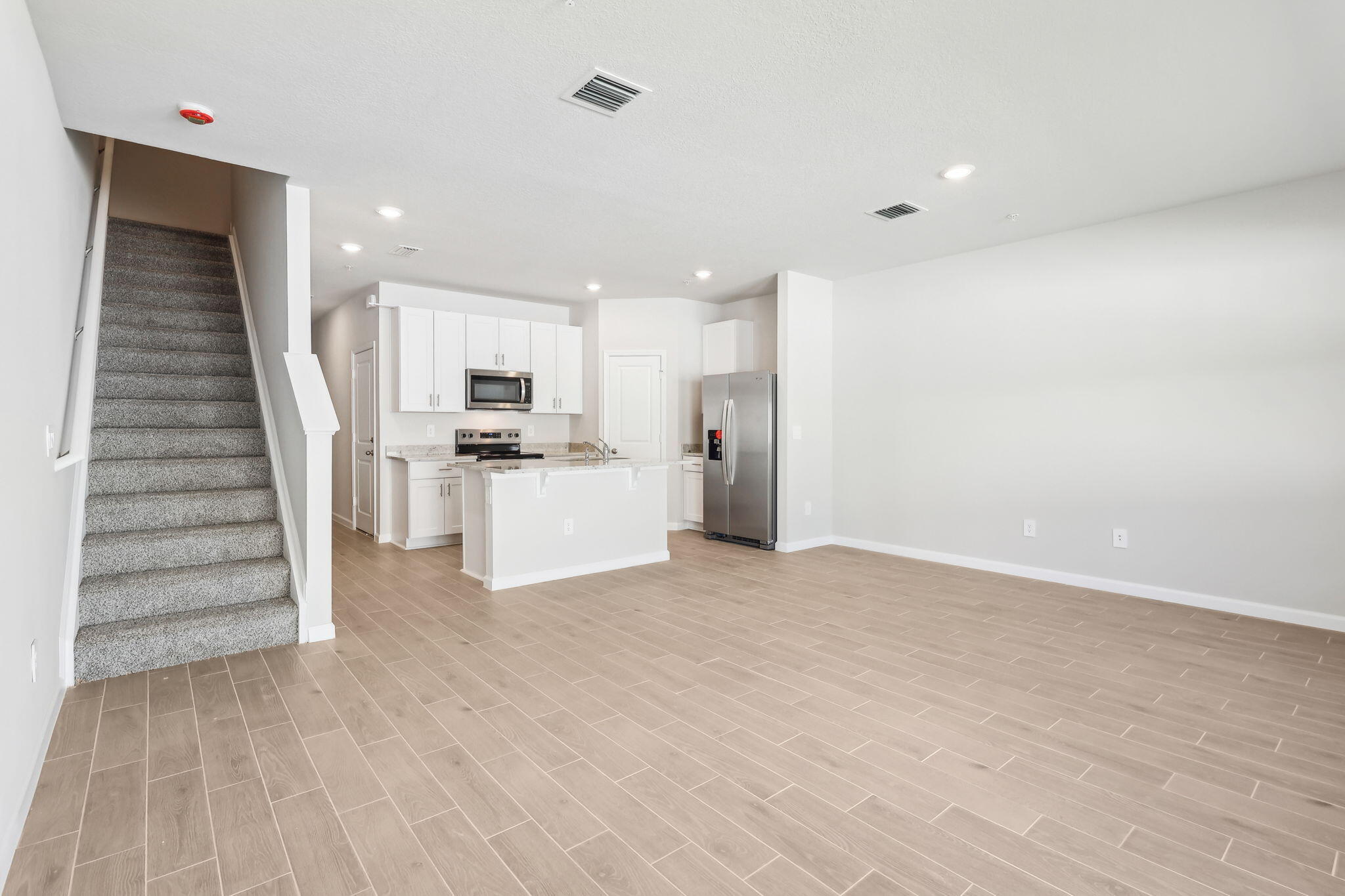 478 Salisbury Circle Fort Pierce, FL 34982 - Photo 7 of 35 a view of a kitchen with wooden floor and electronic appliances