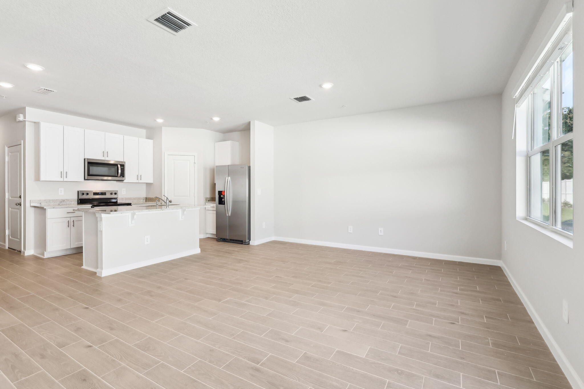478 Salisbury Circle Fort Pierce, FL 34982 - Photo 8 of 35 a view of kitchen with wooden floor and electronic appliances