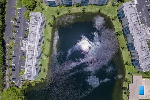 an aerial view of a house with a ocean view