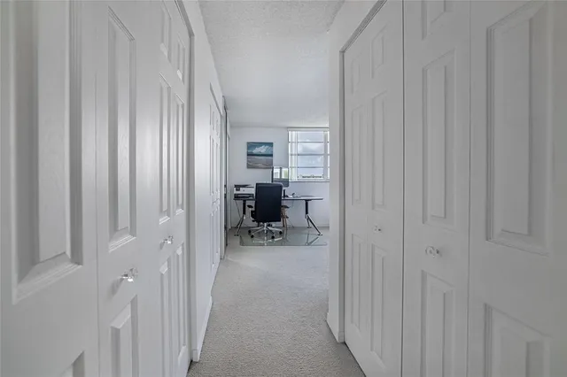 a spacious bedroom with a bed and a window