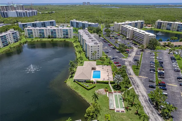 an aerial view of a house with a lake view