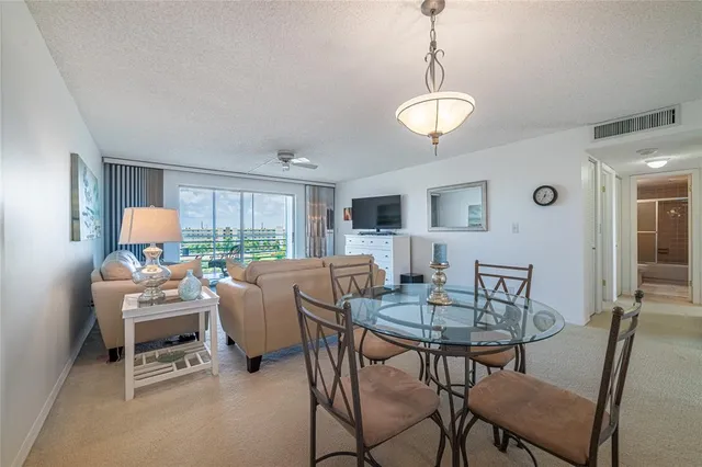 a view of a livingroom with furniture and a table