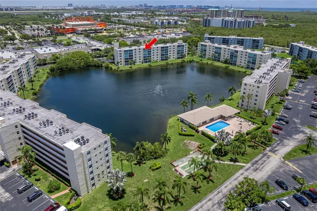 an aerial view of a house with a lake view