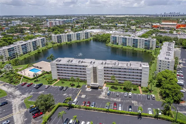an aerial view of a house with a lake view