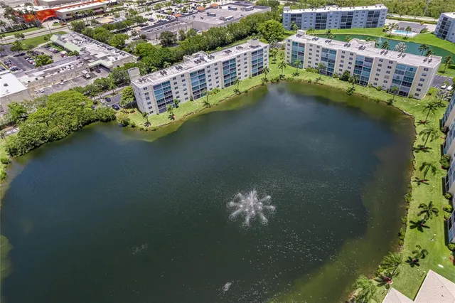 an aerial view of house with yard