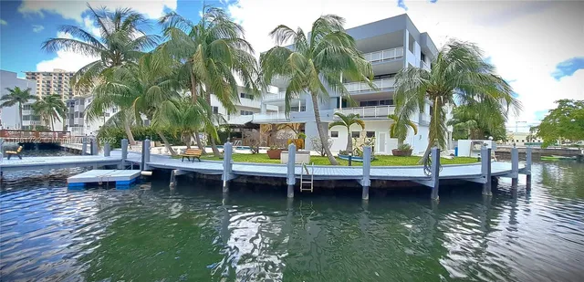 a view of swimming pool with a table and chairs