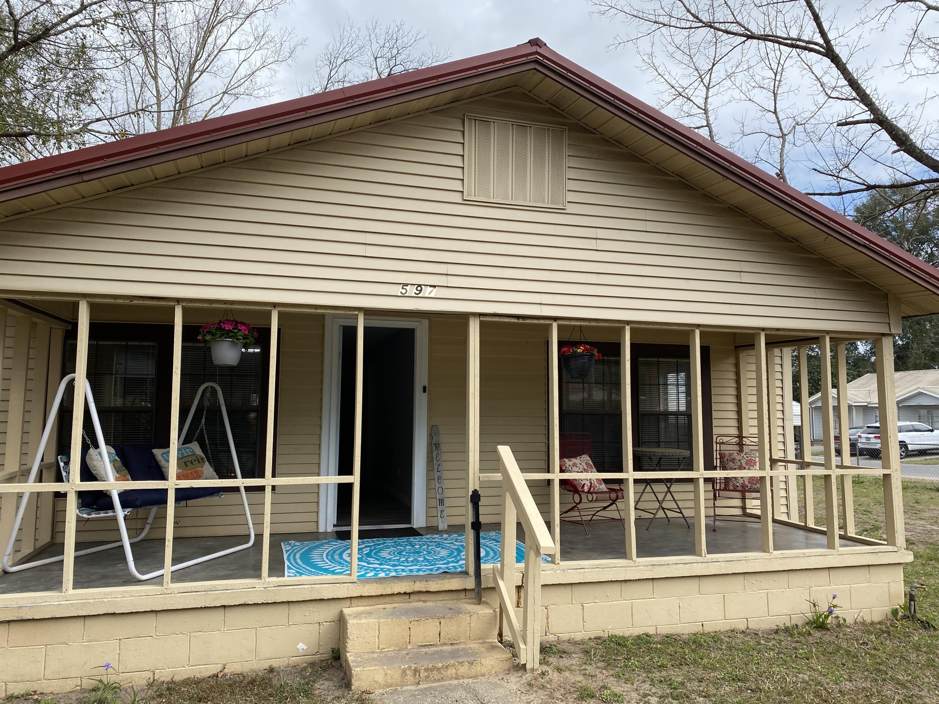597 South Wilson Street Crestview, FL 32536 - Photo 1 of 16 a house with a large window