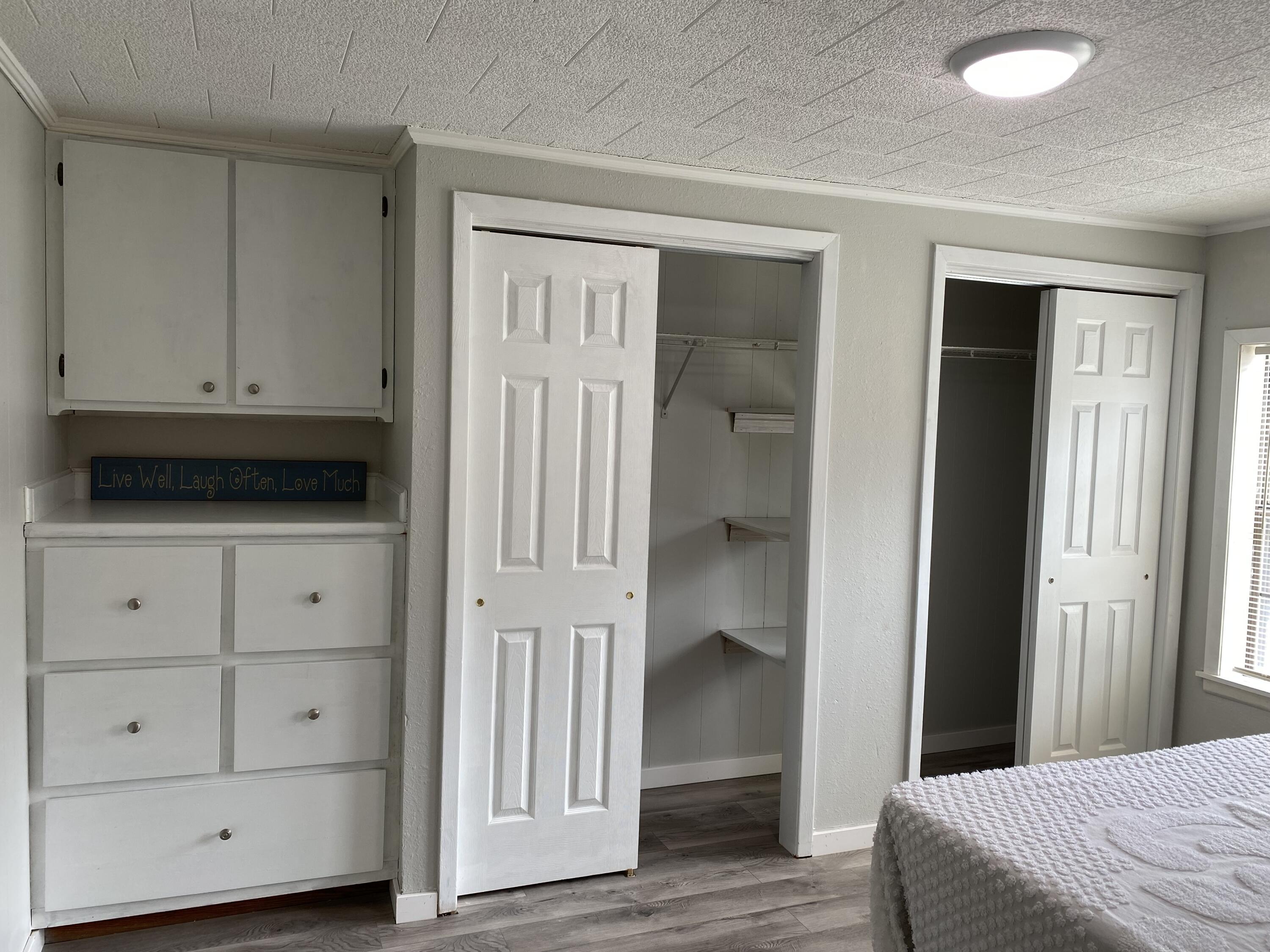 597 South Wilson Street Crestview, FL 32536 - Photo 12 of 16 a view of bedroom with wooden floor