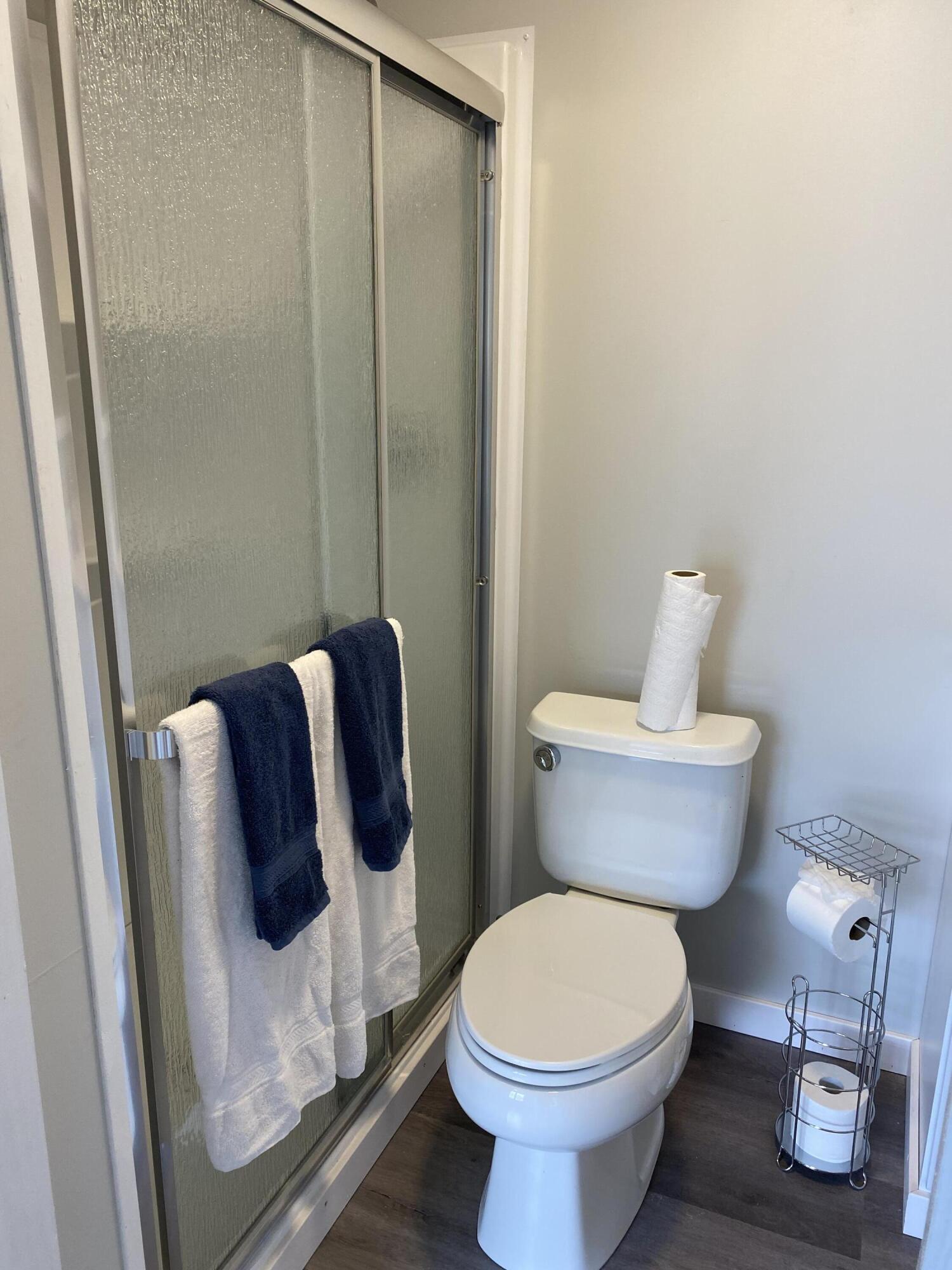 597 South Wilson Street Crestview, FL 32536 - Photo 15 of 16 a white toilet sitting next to a bathroom sink