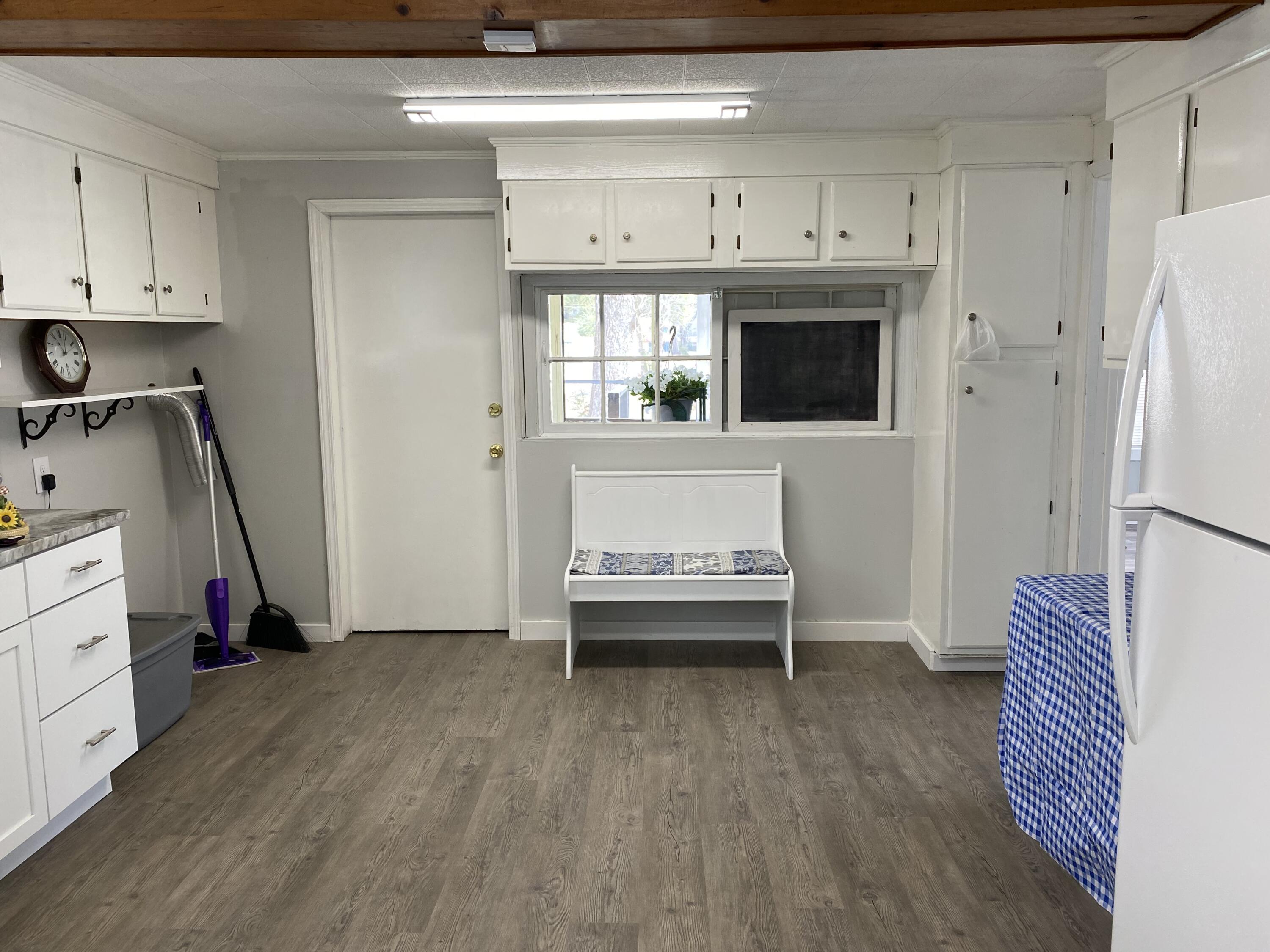 597 South Wilson Street Crestview, FL 32536 - Photo 8 of 16 a view of kitchen with stainless steel appliances wooden floor and counter top space